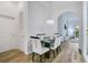 Elegant dining room with chandelier and views into the living area at 103 Rum Run # 103, Davenport, FL 33837