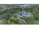 Beautiful aerial view displaying clubhouse with pool, tropical landscaping, and parking at 103 Rum Run # 103, Davenport, FL 33837
