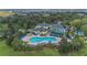 Aerial shot showing the pool and jacuzzi with surrounding lounge chairs and landscaping at 103 Rum Run # 103, Davenport, FL 33837