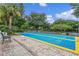 Well-maintained shuffleboard court surrounded by seating and lush landscape at 103 Rum Run # 103, Davenport, FL 33837