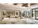Bright lobby with elegant seating, modern lighting fixtures, and open floor plan at 10300 Winter Sparkle Cir, Golden Oak, FL 32836