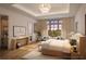Serene main bedroom with a sitting area, large windows, and elegant décor in a Four Seasons residence at 10300 Winter Sparkle Cir, Golden Oak, FL 32836