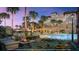 Upscale pool area featuring a cozy fire pit lounge area with plush seating and views at 10300 Winter Sparkle Cir, Golden Oak, FL 32836