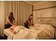 Tranquil spa featuring massage tables and elegant decor at 10300 Winter Sparkle Cir, Golden Oak, FL 32836