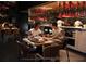 A couple enjoying a delicious meal in a modern restaurant with unique lighting at 10601 Autumn Mist Ln # 302, Golden Oak, FL 32836