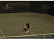 Personal playing tennis on a well-maintained court with a net and green surroundings at 10601 Autumn Mist Ln # 302, Golden Oak, FL 32836