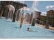 The community waterpark features stone arches, fountains, and playful spaces for Gathering fun and recreation at 10601 Autumn Mist Ln # 302, Golden Oak, FL 32836