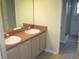 Bathroom featuring double sinks and a walk-in shower at 11618 Grand Bay Blvd, Clermont, FL 34711