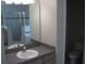 Bathroom view featuring vanity with sink and a glimpse of the shower and toilet at 11618 Grand Bay Blvd, Clermont, FL 34711