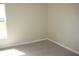 This bedroom is a blank canvas with neutral walls, laminate flooring, and natural light at 11618 Grand Bay Blvd, Clermont, FL 34711
