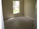 Bedroom with wood floors, neutral paint and a window at 11618 Grand Bay Blvd, Clermont, FL 34711