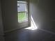 Well-lit bedroom with a view of the backyard at 11618 Grand Bay Blvd, Clermont, FL 34711