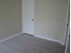 An empty bedroom with neutral walls and laminate flooring at 11618 Grand Bay Blvd, Clermont, FL 34711