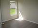 Bedroom with wood floors, neutral paint and a window at 11618 Grand Bay Blvd, Clermont, FL 34711