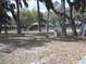 Shady community park with mature trees, picnic tables, and walking paths for residents to enjoy at 11618 Grand Bay Blvd, Clermont, FL 34711