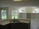 Open kitchen with a breakfast bar overlooking a living area with built-in shelving at 11618 Grand Bay Blvd, Clermont, FL 34711