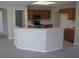 Bright kitchen featuring wood cabinets, stainless steel appliances, and a breakfast bar at 11618 Grand Bay Blvd, Clermont, FL 34711