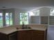 Kitchen bar overlooking a living area with backyard views at 11618 Grand Bay Blvd, Clermont, FL 34711