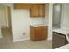 The kitchen is equipped with wooden cabinets, laminate countertops, and stainless steel appliances at 11618 Grand Bay Blvd, Clermont, FL 34711