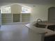 Bright living area with built-in shelving and views into the kitchen space at 11618 Grand Bay Blvd, Clermont, FL 34711