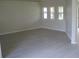 Spacious living area featuring neutral walls and laminate flooring at 11618 Grand Bay Blvd, Clermont, FL 34711