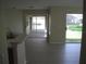 Open living area with sliding glass doors leading to the lanai at 11618 Grand Bay Blvd, Clermont, FL 34711