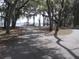 Scenic park path leading to a picturesque waterfront view and a serene setting at 11618 Grand Bay Blvd, Clermont, FL 34711