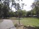 Outdoor volleyball court surrounded by trees, offering a recreational space for community enjoyment at 11618 Grand Bay Blvd, Clermont, FL 34711