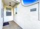 Front entrance with a small covered porch and address plaque at 13407 Fountainbleau Dr # 5-2, Clermont, FL 34711