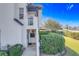 Side view of a house with a walkway, landscaping, and balcony at 13407 Fountainbleau Dr # 5-2, Clermont, FL 34711