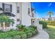 White building with black accents, landscaping, and walkway at 13407 Fountainbleau Dr # 5-2, Clermont, FL 34711