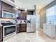 Kitchen boasts stainless steel appliances and ample cabinet space at 13407 Fountainbleau Dr # 5-2, Clermont, FL 34711