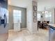 Bright kitchen featuring travertine floors and views into the dining area at 13407 Fountainbleau Dr # 5-2, Clermont, FL 34711