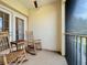 Relaxing screened balcony with rocking chairs at 13407 Fountainbleau Dr # 5-2, Clermont, FL 34711