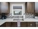 Updated kitchen featuring a white quartz countertop and subway tile backsplash at 135 Dundee Rd, Daytona Beach, FL 32118