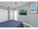 Spacious bedroom with a queen bed and flat-screen TV at 1358 Centre Court Ridge Dr # 202, Reunion, FL 34747