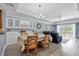 Bright dining area with white cabinets, chandelier, and hardwood floors at 1358 Centre Court Ridge Dr # 202, Reunion, FL 34747