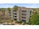 Exterior of a three-story building with balconies and palm trees at 1358 Centre Court Ridge Dr # 202, Reunion, FL 34747