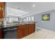 Modern kitchen featuring dark wood cabinets and granite countertops at 1358 Centre Court Ridge Dr # 202, Reunion, FL 34747