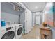 Convenient laundry room with washer, dryer, and storage at 1358 Centre Court Ridge Dr # 202, Reunion, FL 34747