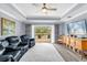 Living room with access to balcony and reclining sofas at 1358 Centre Court Ridge Dr # 202, Reunion, FL 34747