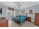 Relaxing main bedroom with a ceiling fan and large windows at 1358 Centre Court Ridge Dr # 202, Reunion, FL 34747