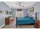 Main bedroom with a king bed and access to balcony at 1358 Centre Court Ridge Dr # 202, Reunion, FL 34747