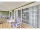 Private patio with seating area and sliding glass doors at 1358 Centre Court Ridge Dr # 202, Reunion, FL 34747