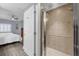 Walk-in shower with glass enclosure and tiled walls at 1358 Centre Court Ridge Dr # 202, Reunion, FL 34747