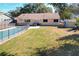 A backyard view of a home featuring a fenced pool, patio, shed, and green grass at 164 Morning Glory Dr, Lake Mary, FL 32746