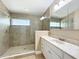 Beautiful bathroom featuring a glass shower, a vanity with white cabinets and marble countertops at 164 Morning Glory Dr, Lake Mary, FL 32746