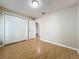This bedroom has beautiful hardwood floors, a closet, and a door to other rooms in the house at 164 Morning Glory Dr, Lake Mary, FL 32746