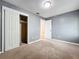 This cozy bedroom showcases a spacious closet and door leading to other areas of the home at 164 Morning Glory Dr, Lake Mary, FL 32746