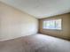 A bedroom with carpet flooring and a double window, allowing for plenty of natural light at 164 Morning Glory Dr, Lake Mary, FL 32746